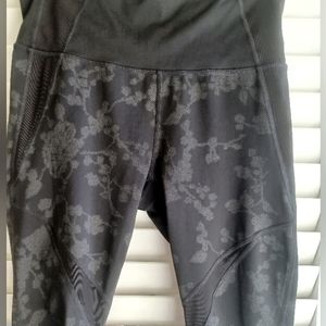 Athleta Moonlight Precision Leggings in Black and Gray.